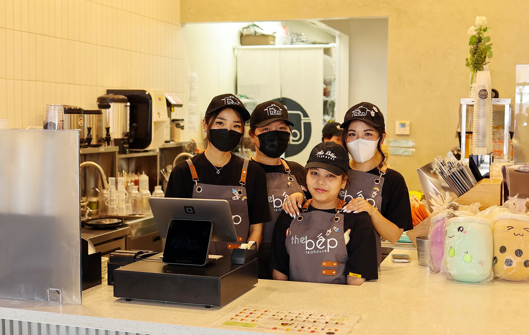 Four The Bep Employees standing behind the counter